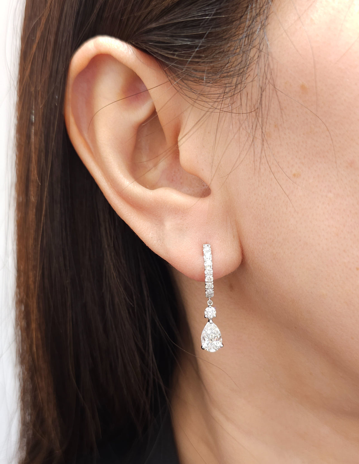 pear cut earring on ear