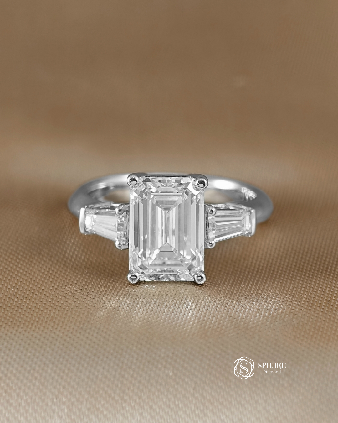 Emerald Diamond Ring with Tapered Diamond