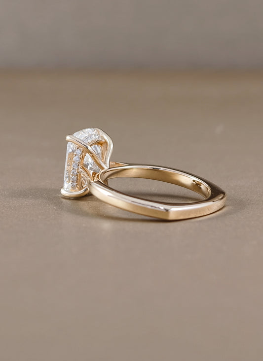 A yellow gold ring engagement ring