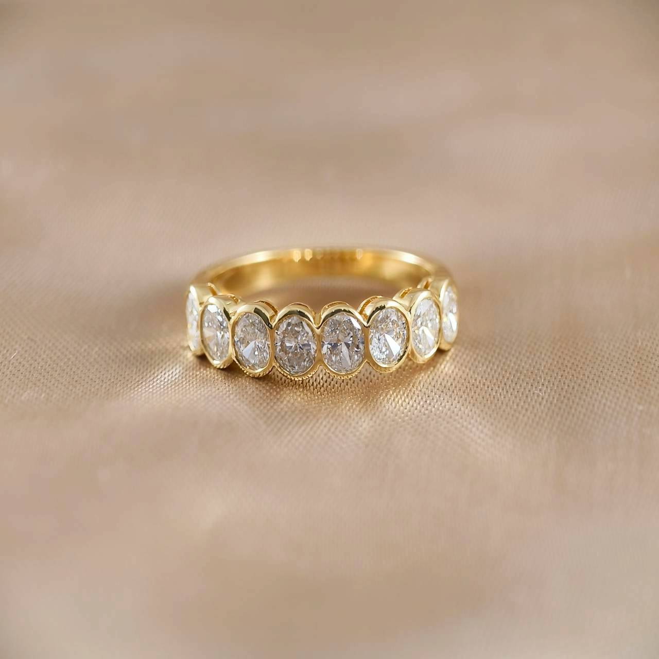 Oval Cut Half Eternity Bezel Love Ring