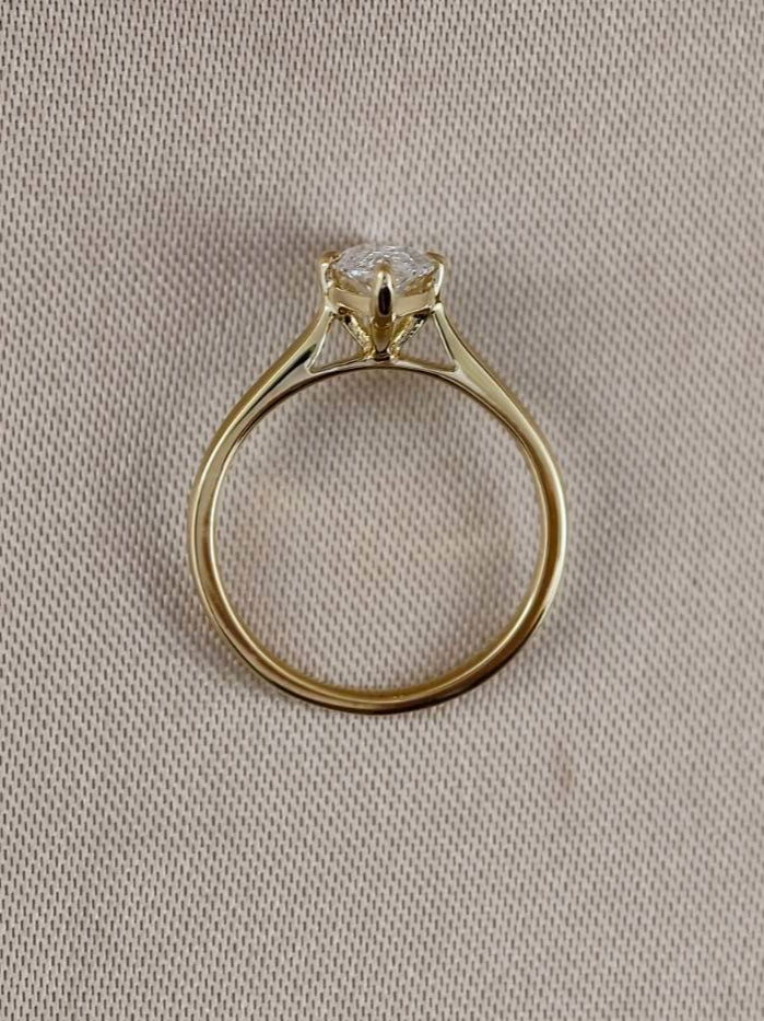 Side profile of a Marquise Lab Grown Diamond Engagement Ring with classic solitaire setting in 18K Yellow Gold