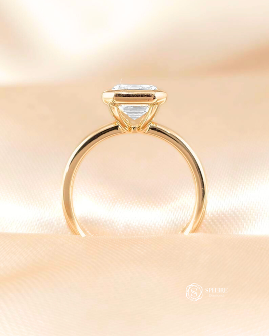 IGI certified emerald cut lab grown diamond bezel engagement ring side profile in yellow gold