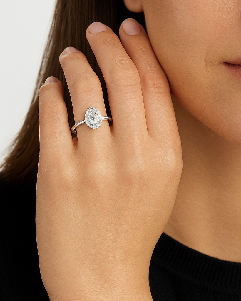 Woman wearing Aurora Oval Halo Lab Grown Diamond Engagement Ring in 18K White Gold by Sphere Diamond Bangkok