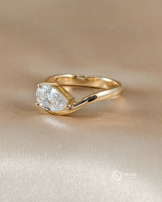 Side view of Pear Lab Grown Diamond Twist Bypass Engagement Ring in 18K Yellow Gold | IGI Certified | Sphere Diamond