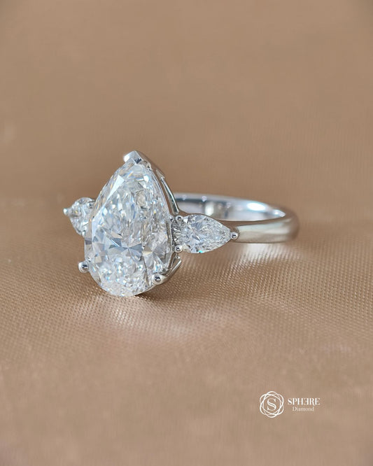Left angle of Elara pear lab grown diamond three stone engagement ring | IGI Certified | Sphere Diamond Bangkok