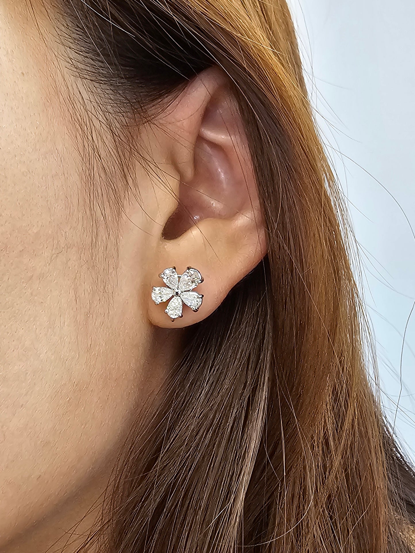 Model wearing Floral Blossom pear lab grown diamond stud earrings by Sphere Diamond Bangkok