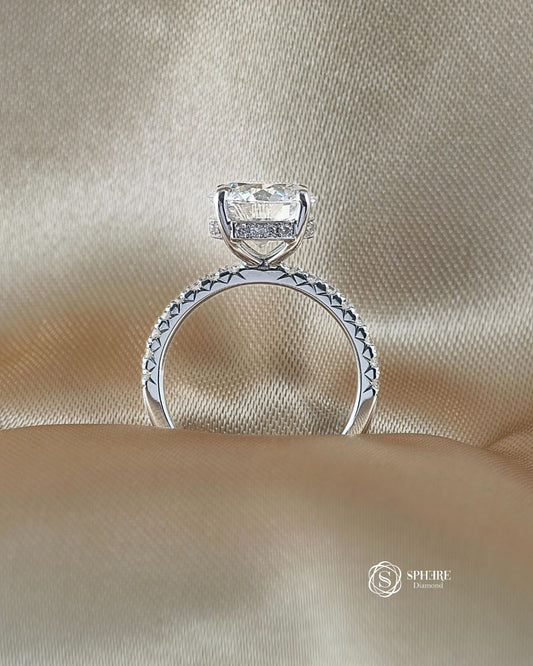 Side profile of Signature Eiffel Love Round Lab Grown Diamond Engagement Ring featuring an IGI Certified round brilliant diamond
