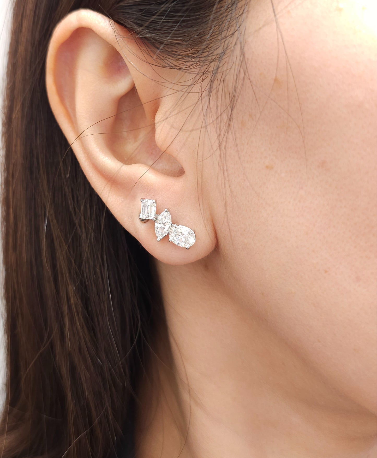 Woman wearing Trinity Emerald Marquise and Oval Lab Grown Diamond Climber Stud Earrings by Sphere Diamond