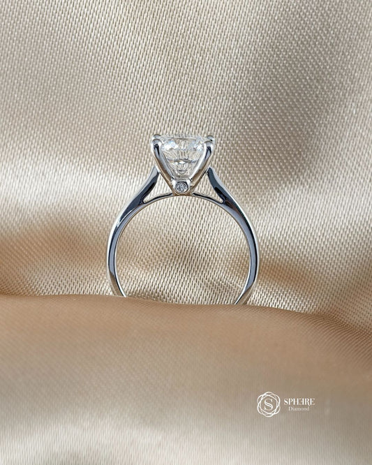 Side profile of V Solitaire Round Lab Grown Diamond Engagement Ring showing hidden side diamond and elegant V setting in 18K White Gold