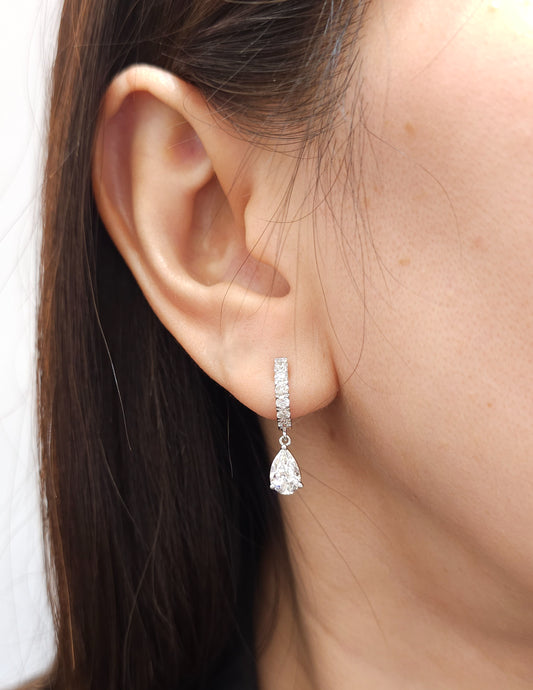pear earring on ear 