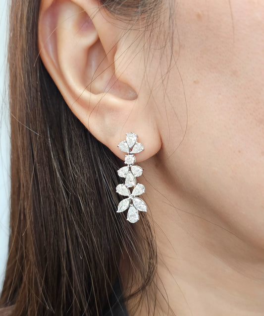 wearing a white gold earring 