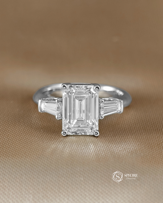 Emerald Diamond Ring with Tapered Diamond