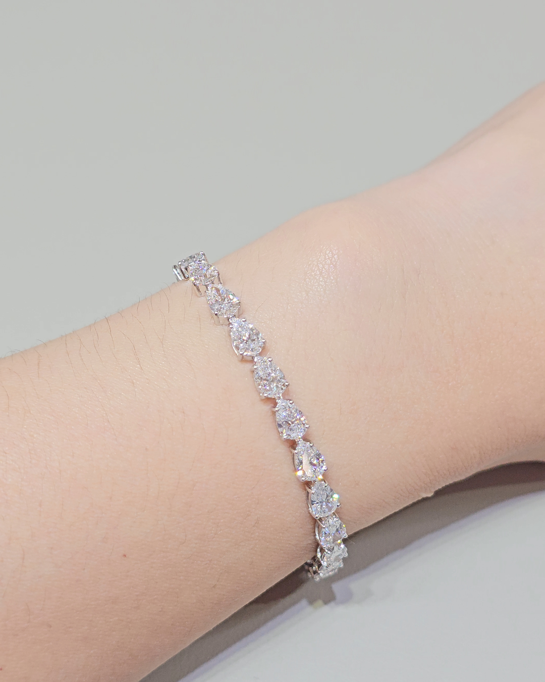 Pear Cut Lab Grown Diamond Tennis Bracelet on wrist Sphere Diamond Bangkok