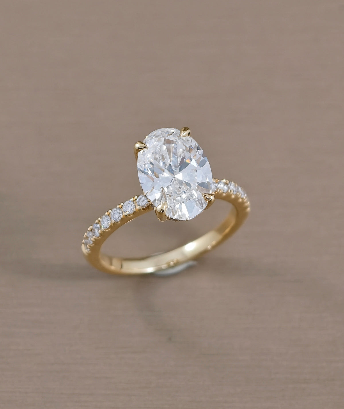 Signature Eiffel love oval lab grown diamond engagement ring in yellow gold | IGI Certified