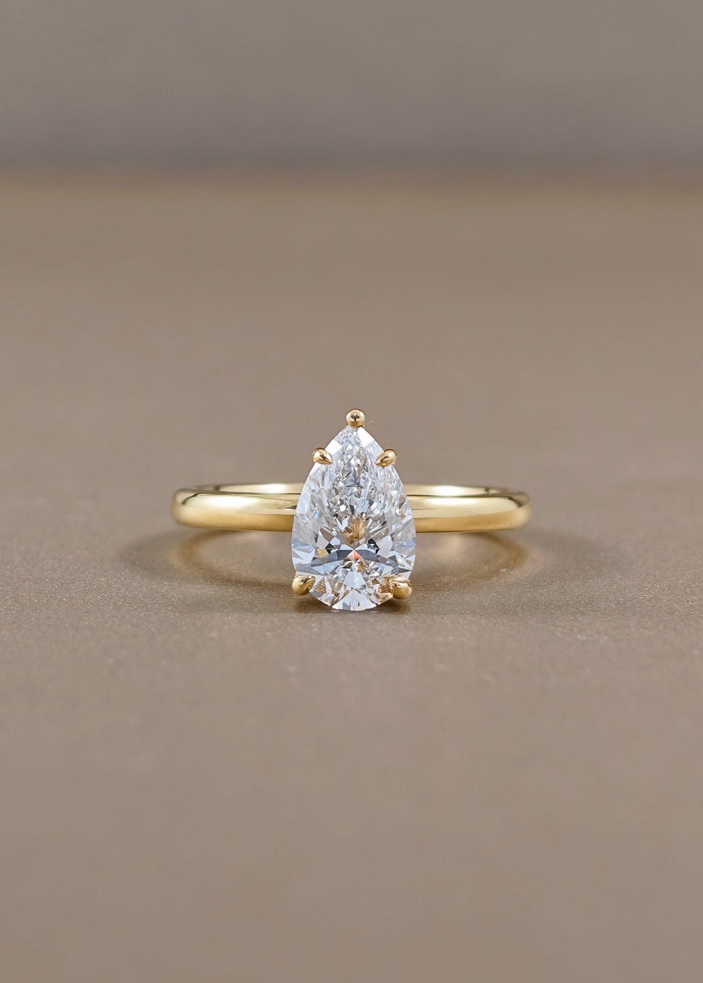 Solène Pear Cut Lab Grown Diamond Solitaire Engagement Ring in Yellow Gold Sphere Diamond Bangkok