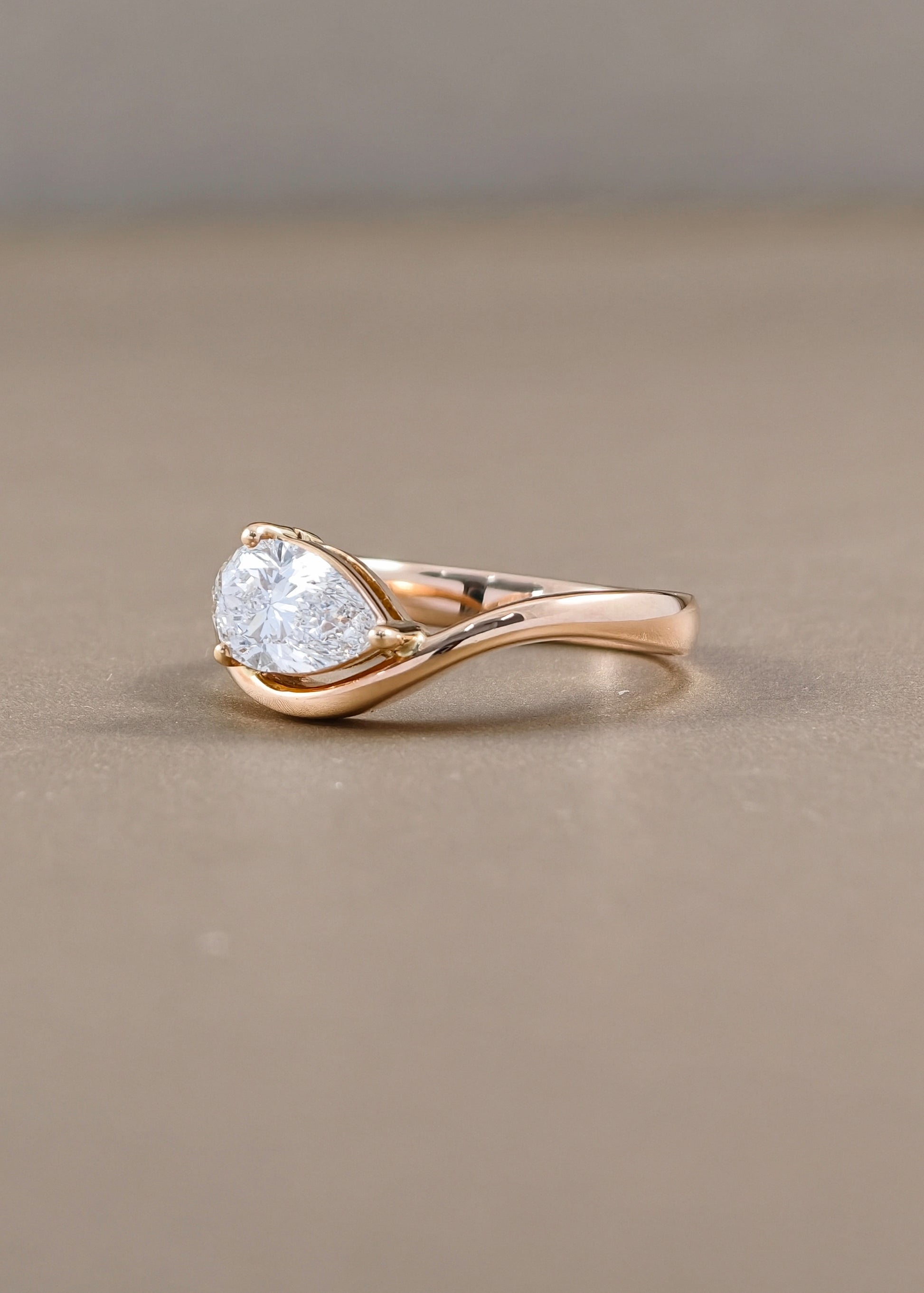 Rosalie Pear Cut Lab Grown Diamond Crossover Engagement Ring in Pink Gold Sphere Diamond Bangkok