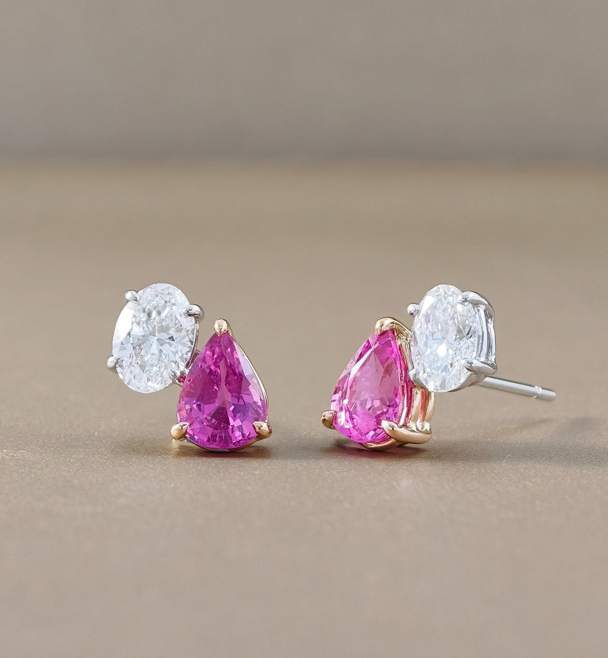Side profile of Toi et Moi sapphire and oval lab grown diamond earrings with prong settings