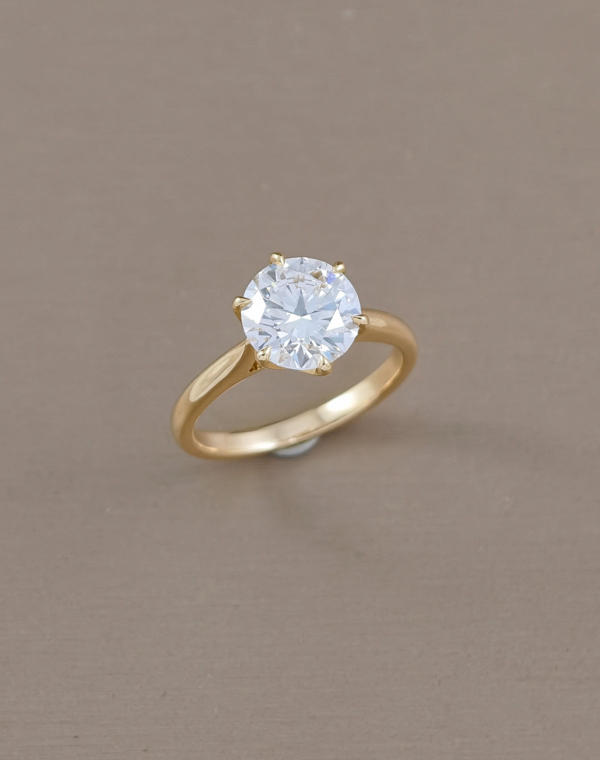 Flora Tulip Round Solitaire Lab Grown Diamond Engagement Ring in yellow gold | IGI Certified