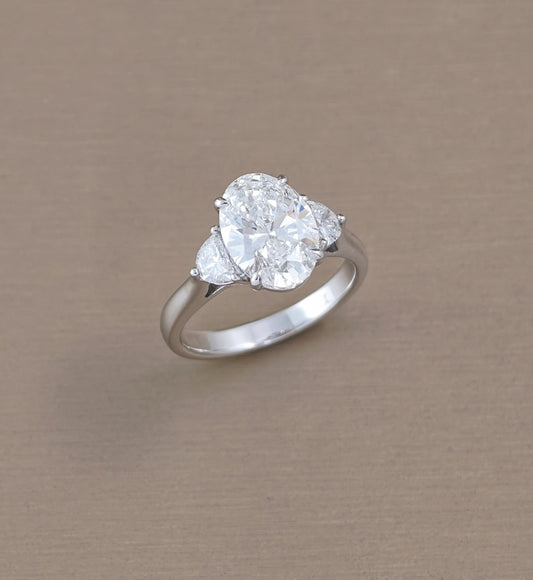 Oval Lab Grown Diamond Ring with Half-Moon Side Stones Three Quarter View