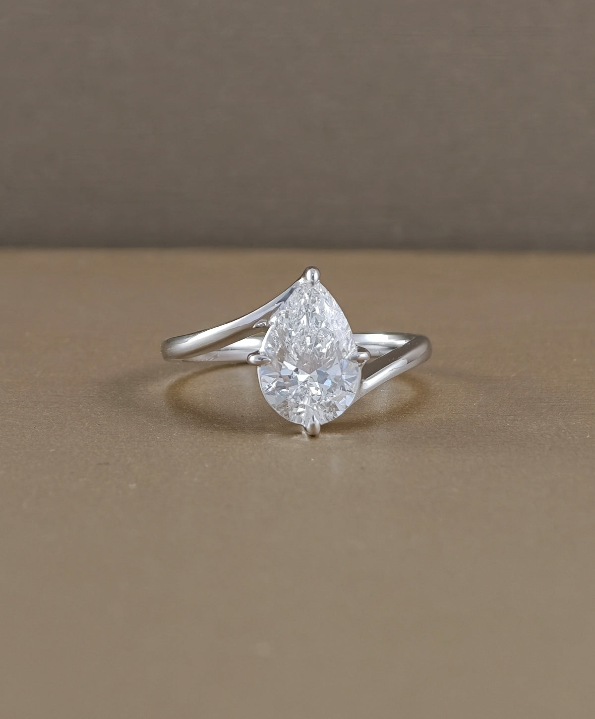 Pear cut lab grown diamond engagement ring with elegant curved white gold band by Sphere Diamond Bangkok