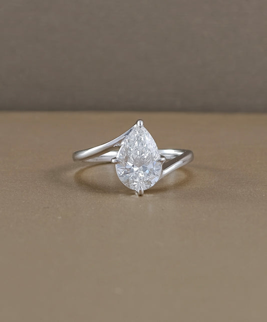 Pear cut lab grown diamond engagement ring with elegant curved white gold band by Sphere Diamond Bangkok