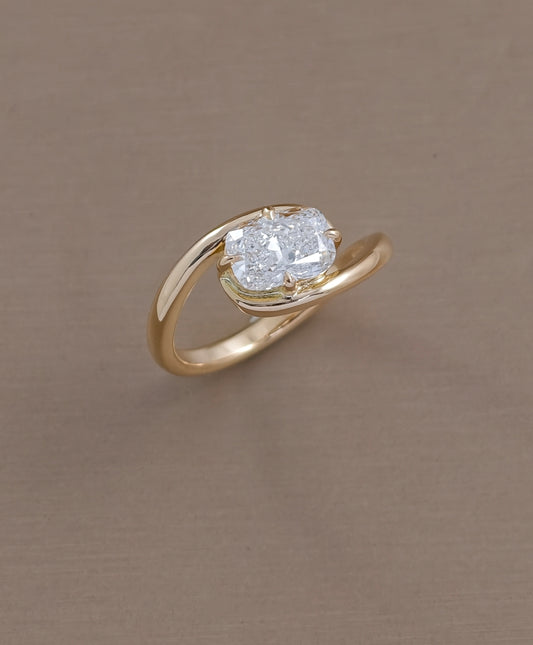 East-West cushion cut lab grown diamond engagement ring with twist yellow gold band by Sphere Diamond