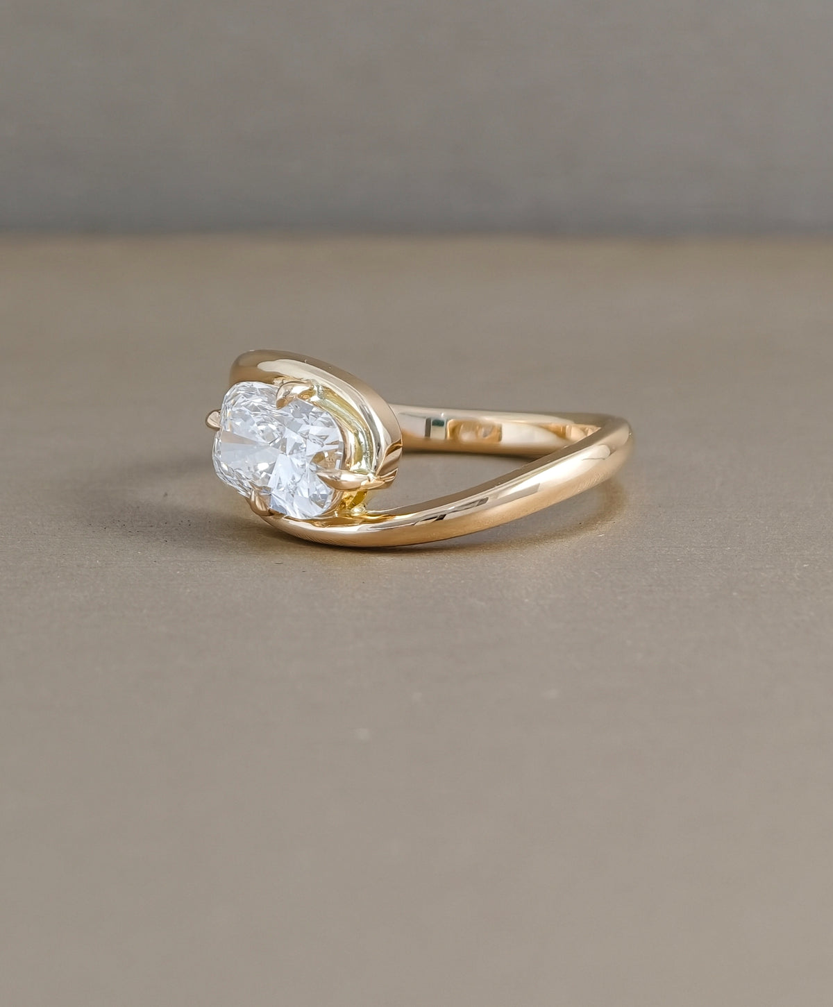 Rear view of yellow gold cushion cut lab grown diamond engagement ring showing twist band construction