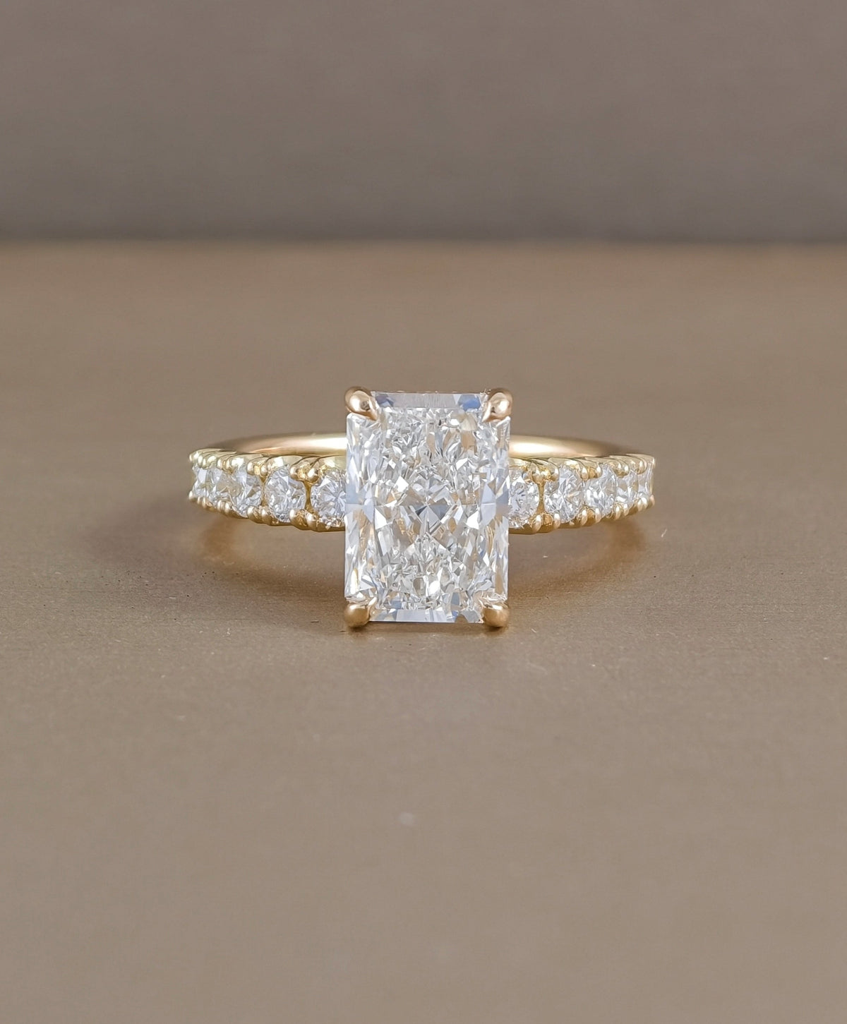 Radiant cut lab grown diamond engagement ring with pavé diamond band in yellow gold by Sphere Diamond Bangkok