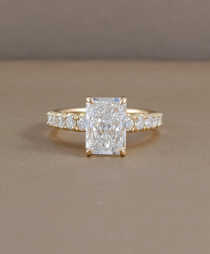 Radiant cut lab grown diamond engagement ring with pavé diamond band in yellow gold by Sphere Diamond Bangkok