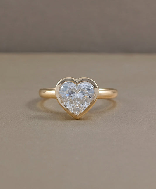 Heart shaped bezel set lab grown diamond engagement ring in yellow gold by Sphere Diamond Bangkok
