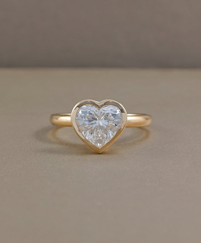 Heart shaped bezel set lab grown diamond engagement ring in yellow gold by Sphere Diamond Bangkok