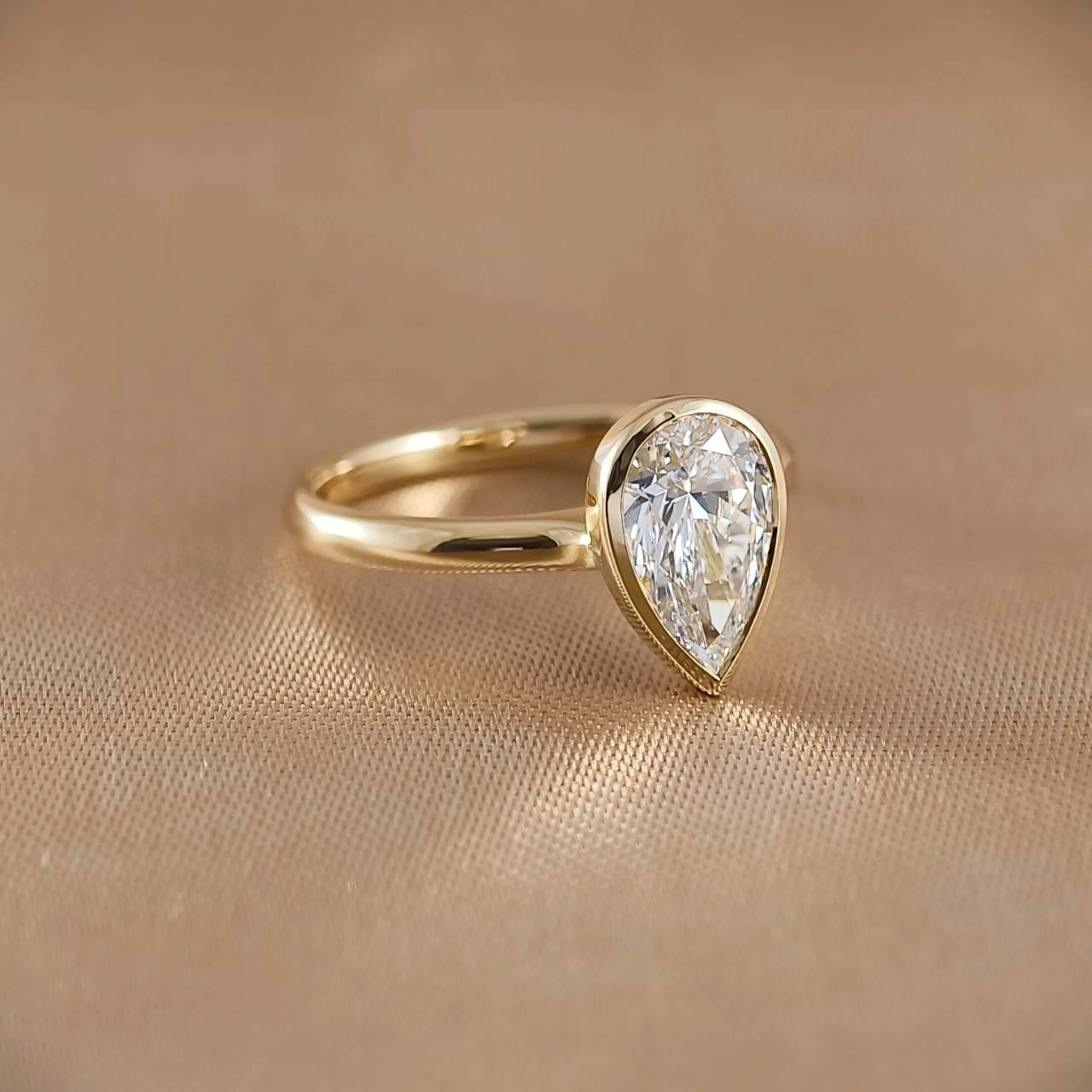 Pear Cut Bezel Love Ring