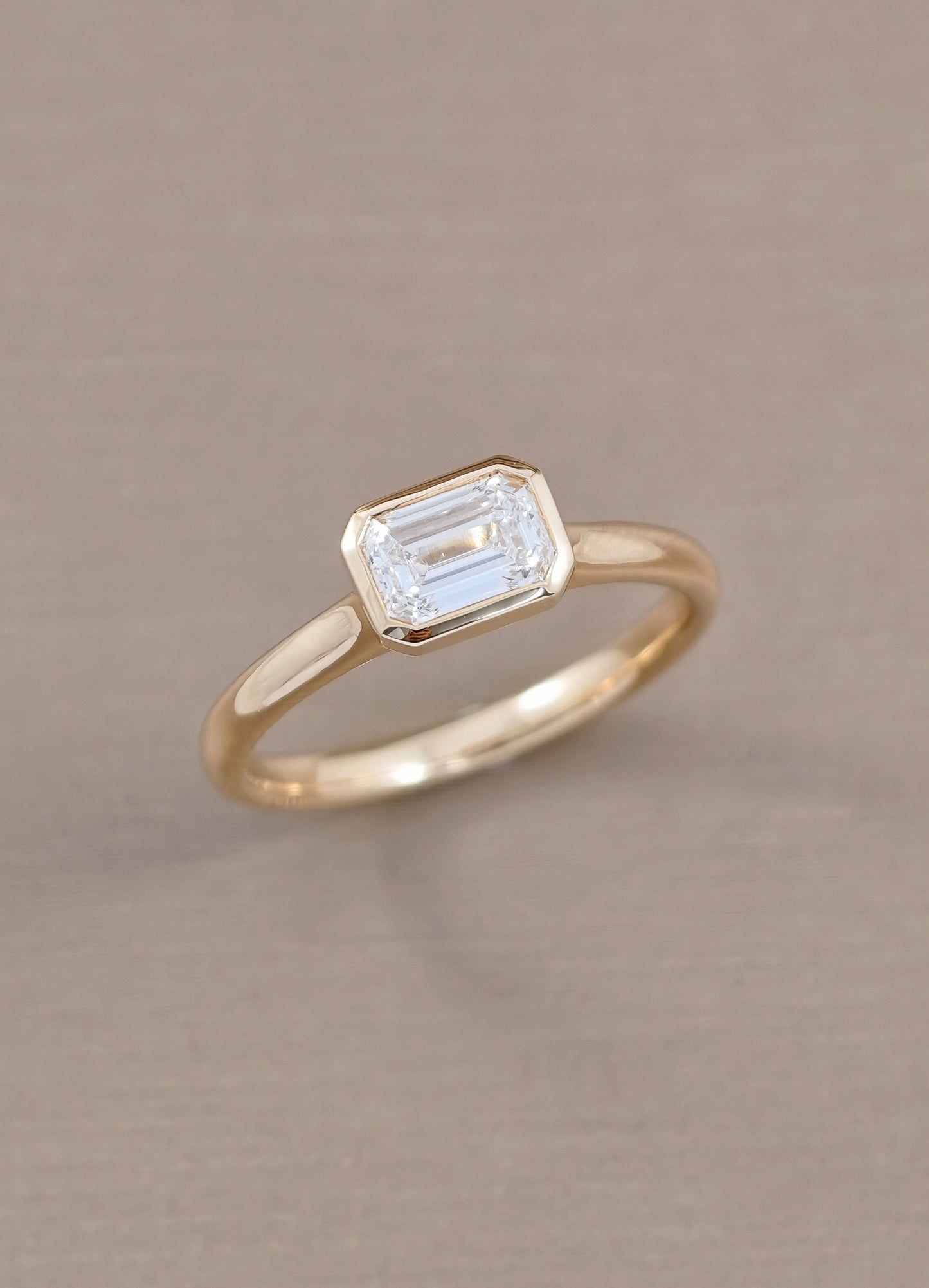 Elara East-West Emerald Cut Lab Grown Diamond Bezel Engagement Ring