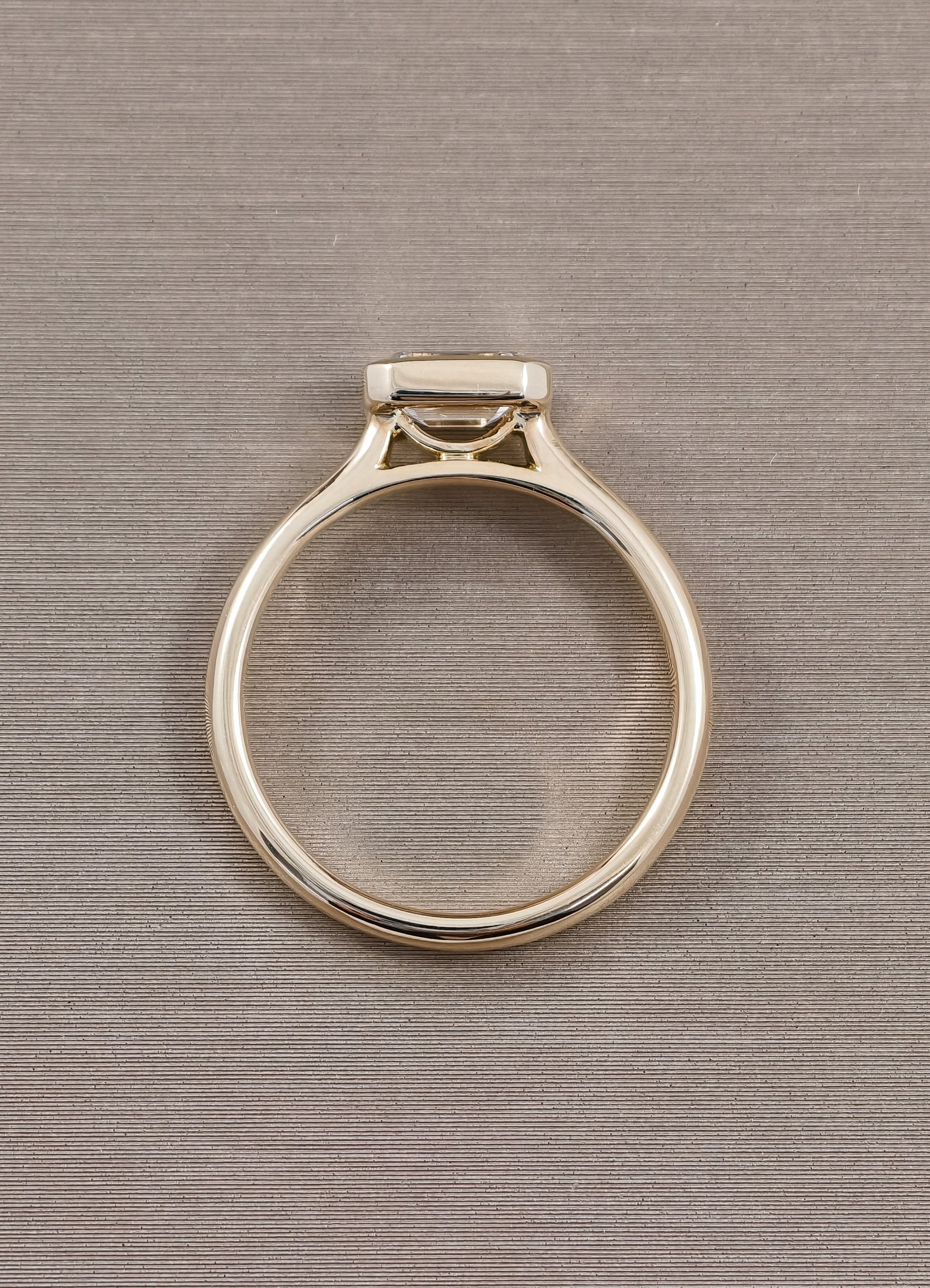 East-West Emerald Cut Lab Grown Diamond Bezel Engagement Ring in Yellow Gold by Sphere Diamond Bangkok