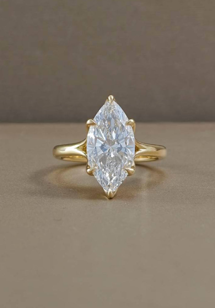 Back view of marquise tulip engagement ring showing sculpted floral gold setting and open gallery