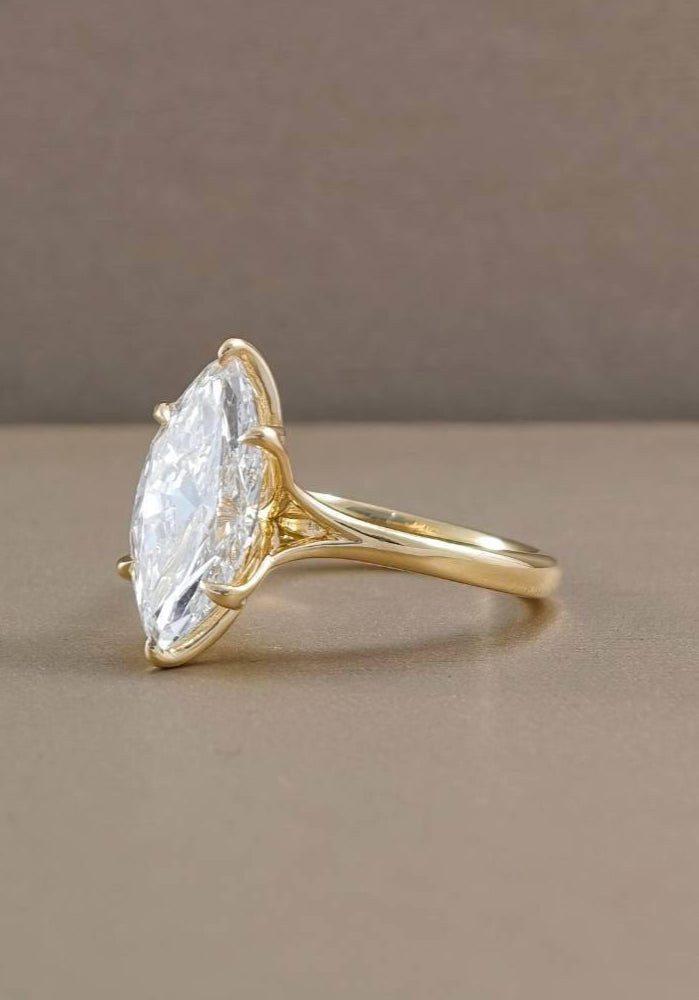 Back view of marquise tulip engagement ring showing sculpted floral gold setting and open gallery