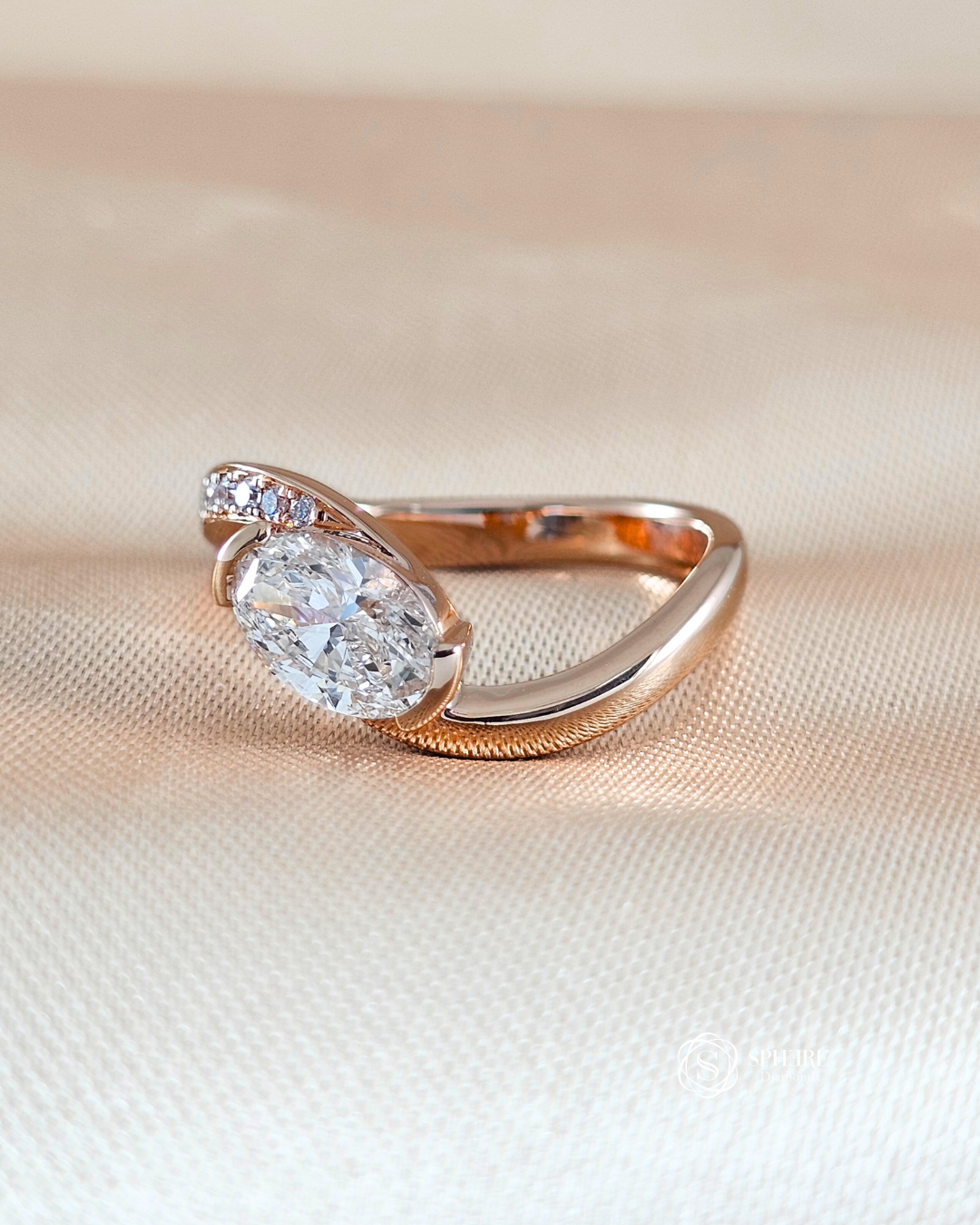 Side view of Aurora Oval Curve Half Pavé Lab Grown Diamond Engagement Ring featuring an IGI Certified Oval Diamond in 18K Rose Gold