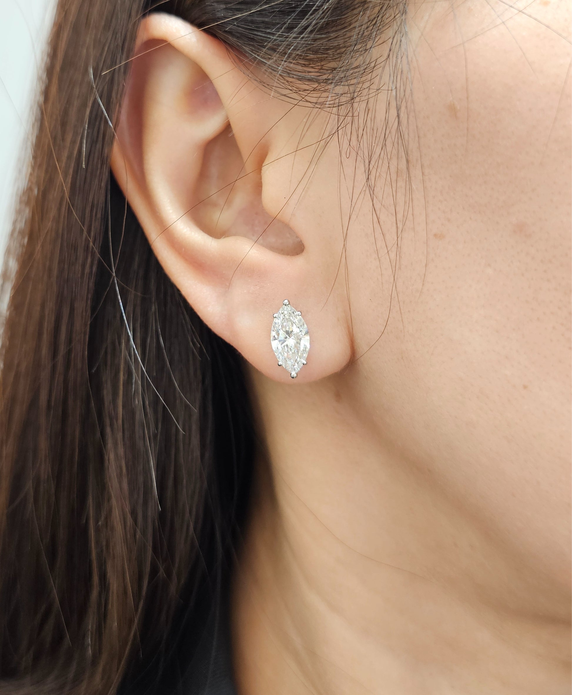 Aveline Marquise Lab Grown Diamond Stud Earrings worn on ear featuring IGI Certified lab grown diamonds by Sphere Diamond