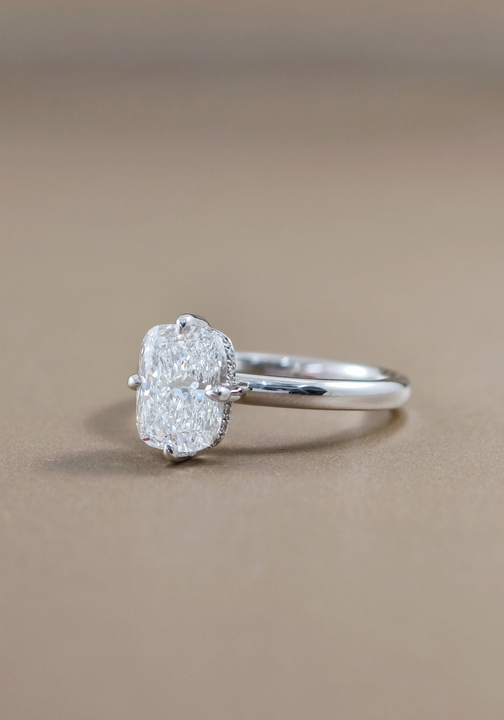Side profile of Celeste cushion cut lab grown diamond solitaire engagement ring with IGI certified lab grown diamond