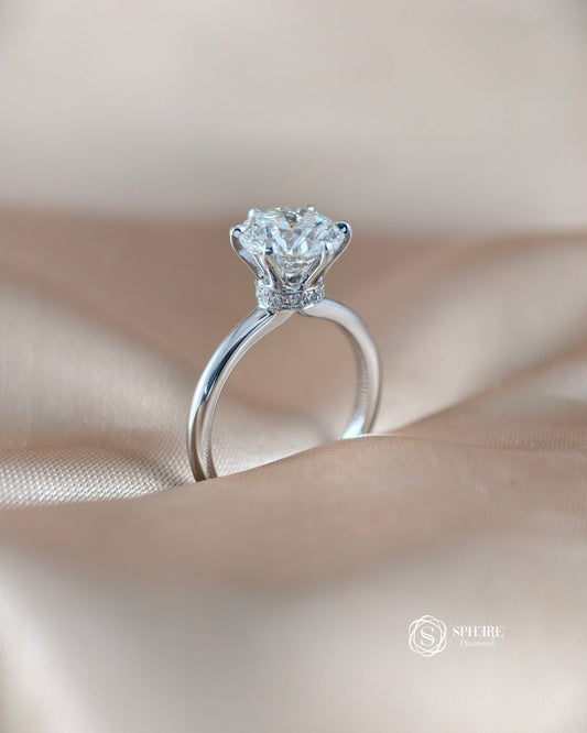 Angled view of Celeste Round Lab Grown Diamond Cathedral Solitaire Engagement Ring with Hidden Wrap | IGI Certified