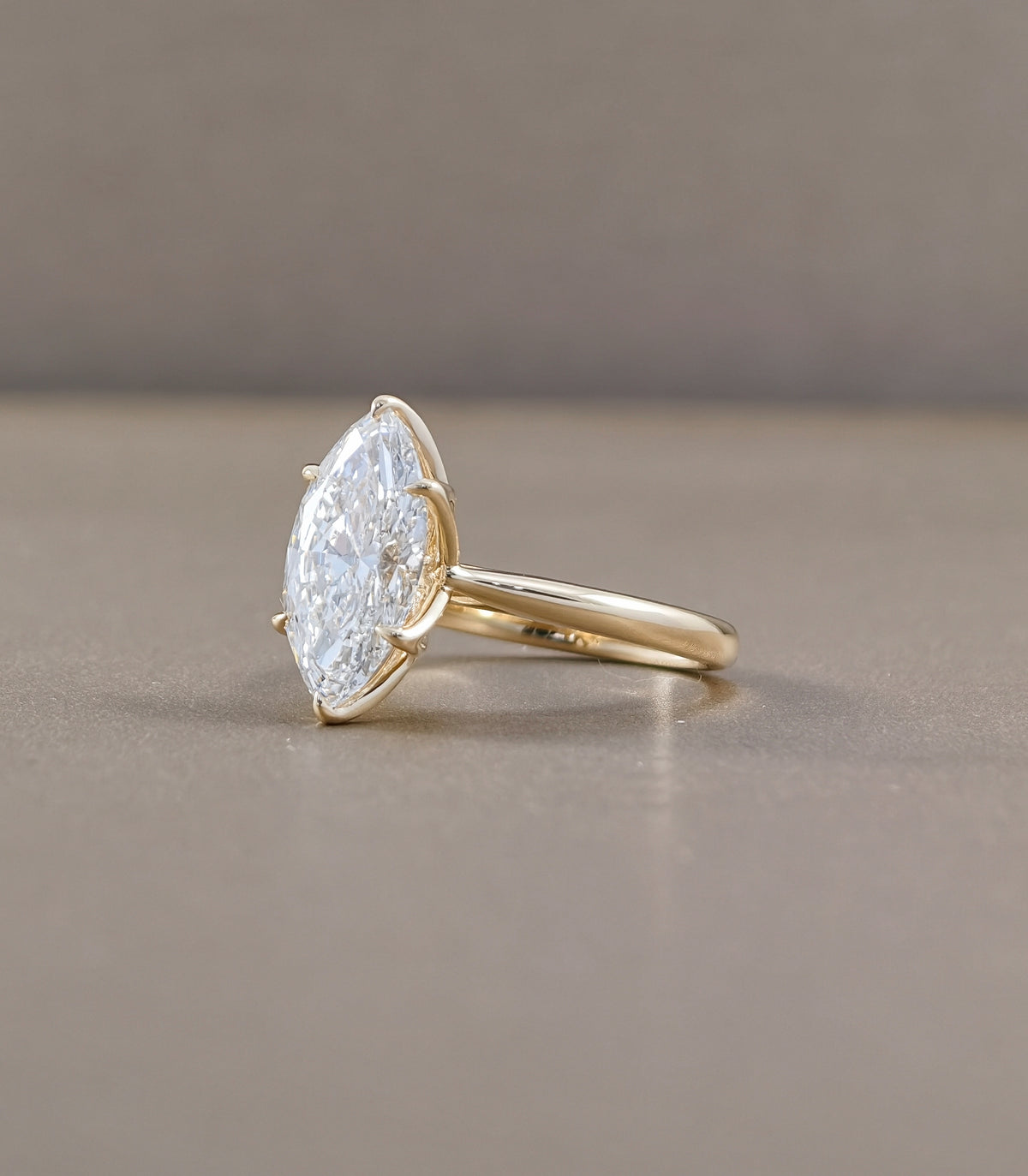 Yellow Gold Marquise Diamond Solitaire Ring with Cathedral Setting Side View