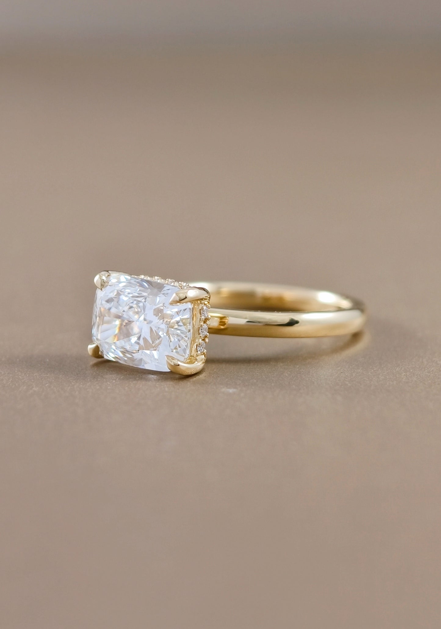 East-west cushion cut lab grown diamond ring