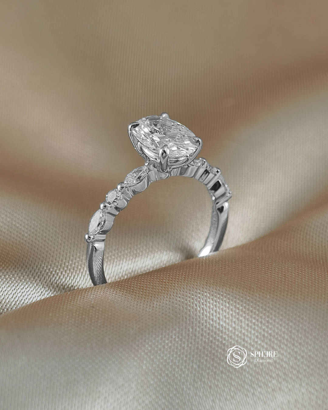 Elegant Oval Lab Grown Diamond Ring with Marquise and Round Side Stones handcrafted in 18K White Gold by Sphere Diamond Thailand