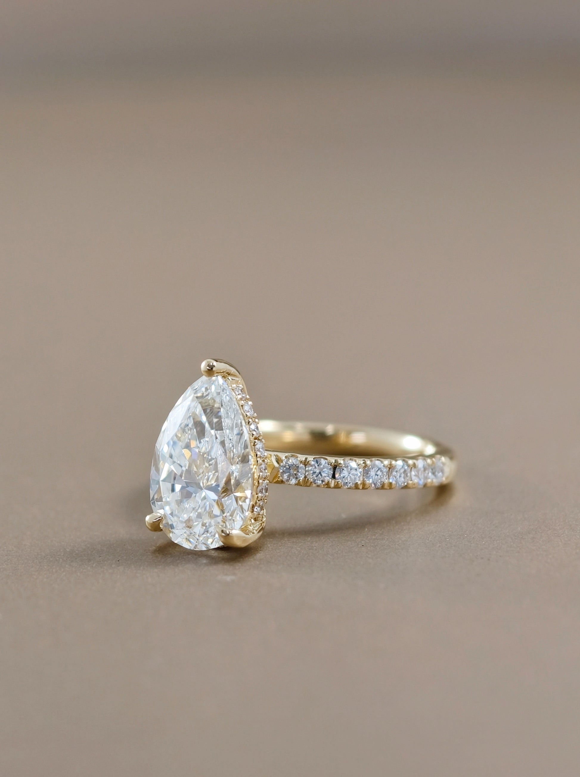 Pear Shape Lab Grown Diamond Pavé Engagement Ring side view Sphere Diamond