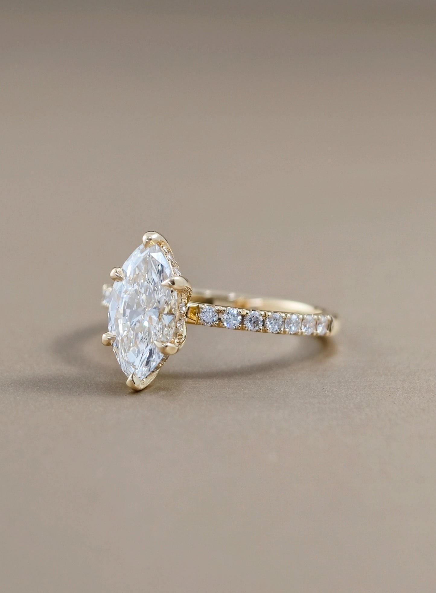 Side view of marquise lab grown diamond engagement ring with pavé band and IGI certified diamond in Bangkok