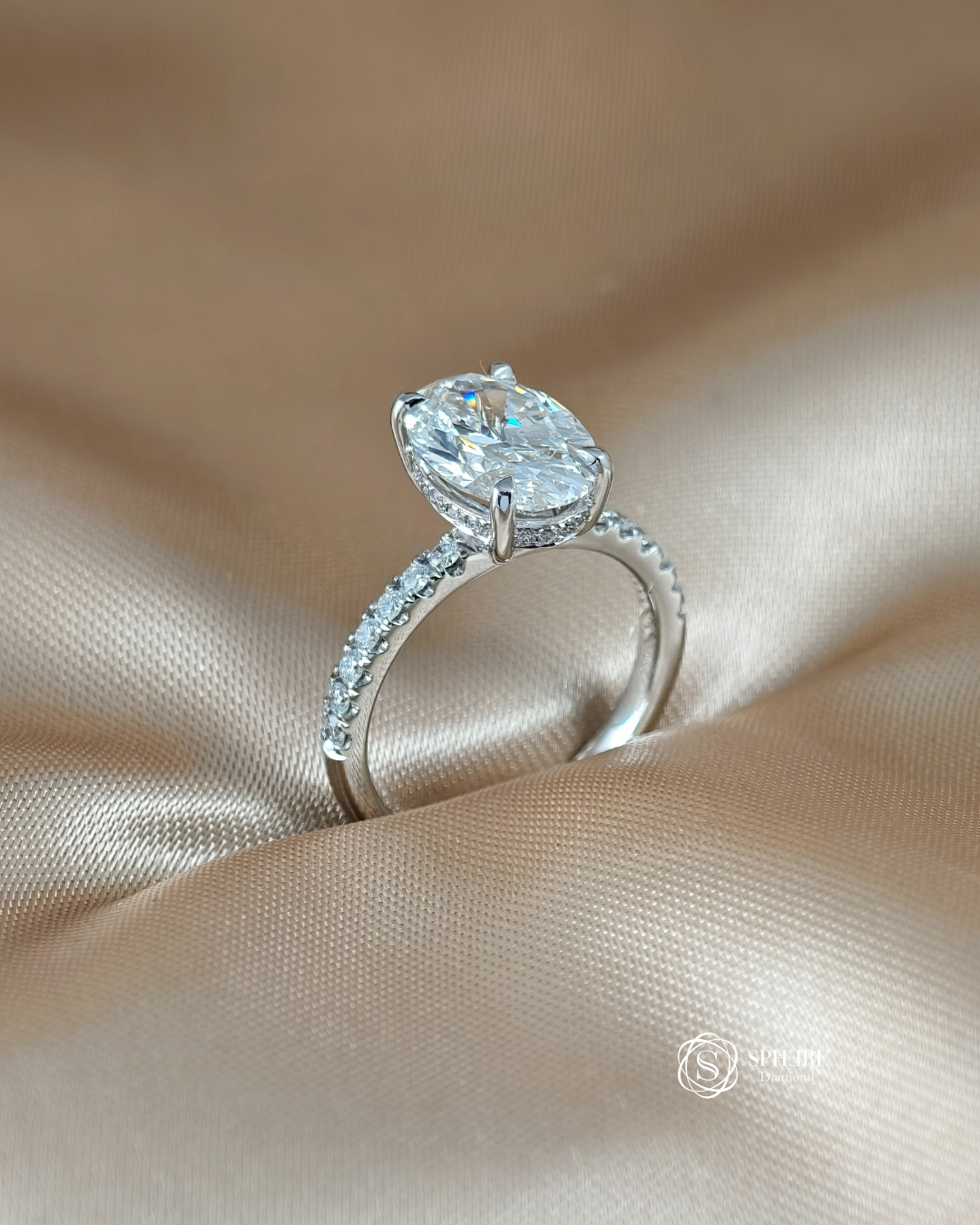 Side profile of the Signature Eiffel Love Oval Lab Grown Diamond Ring showcasing an IGI Certified oval diamond with a handcrafted pavé band in 18K white gold.