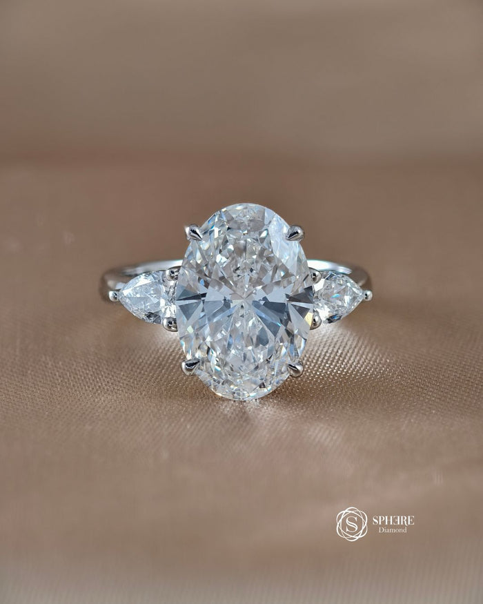 Three Stone Oval Lab Grown Diamond Engagement Ring in 18K White Gold by Sphere Diamond Bangkok featuring an IGI Certified Oval Cut Diamond