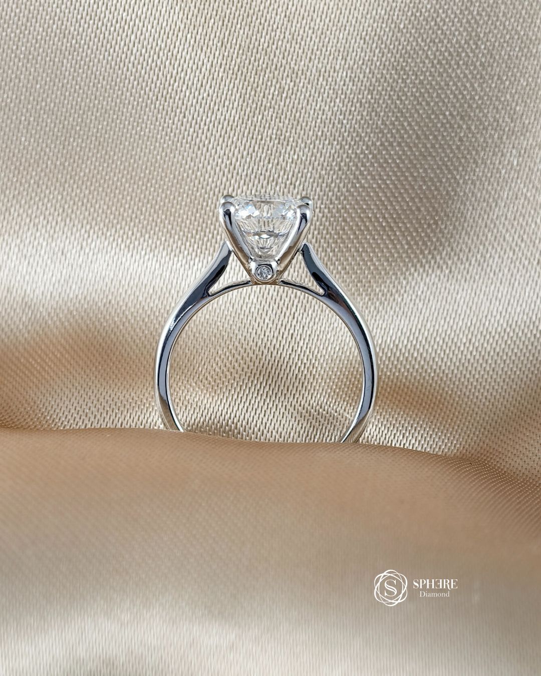Side profile of V Solitaire Round Lab Grown Diamond Engagement Ring showing hidden side diamond and elegant V setting in 18K White Gold