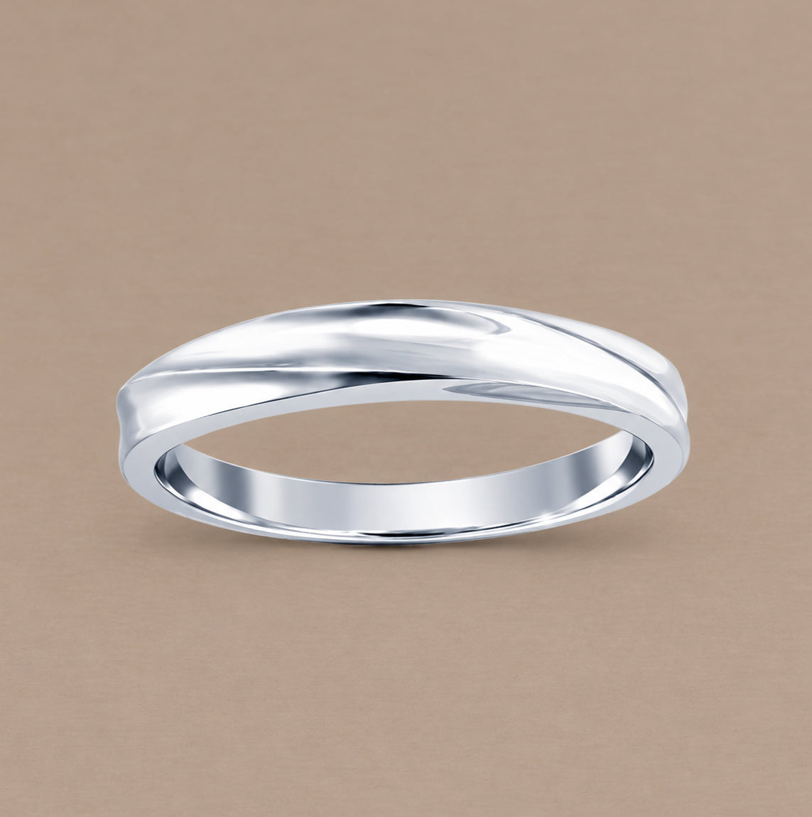 A polished white gold band ring with a wavy, fluid organic curve, displayed on a solid warm beige background.